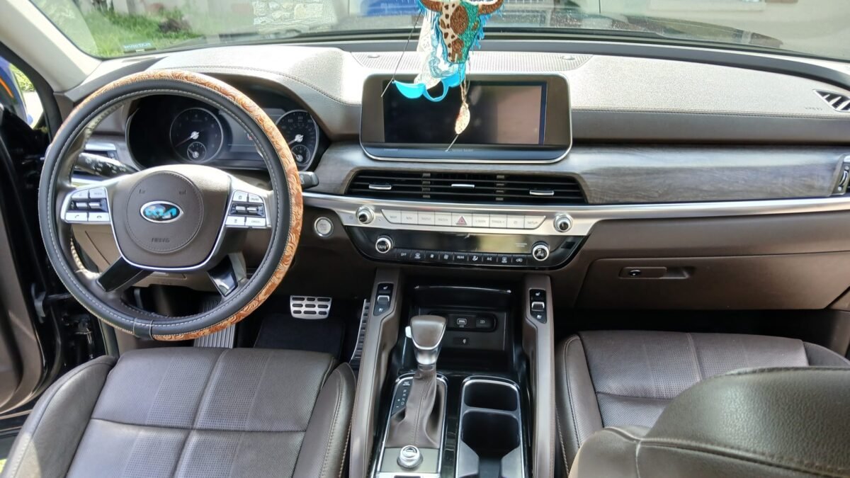 close up of a car's leather seats, dashboard, steering wheel, and center console after professional cleaning and polishing, showing a spotless, shiny finish-aces mobile cleaning
